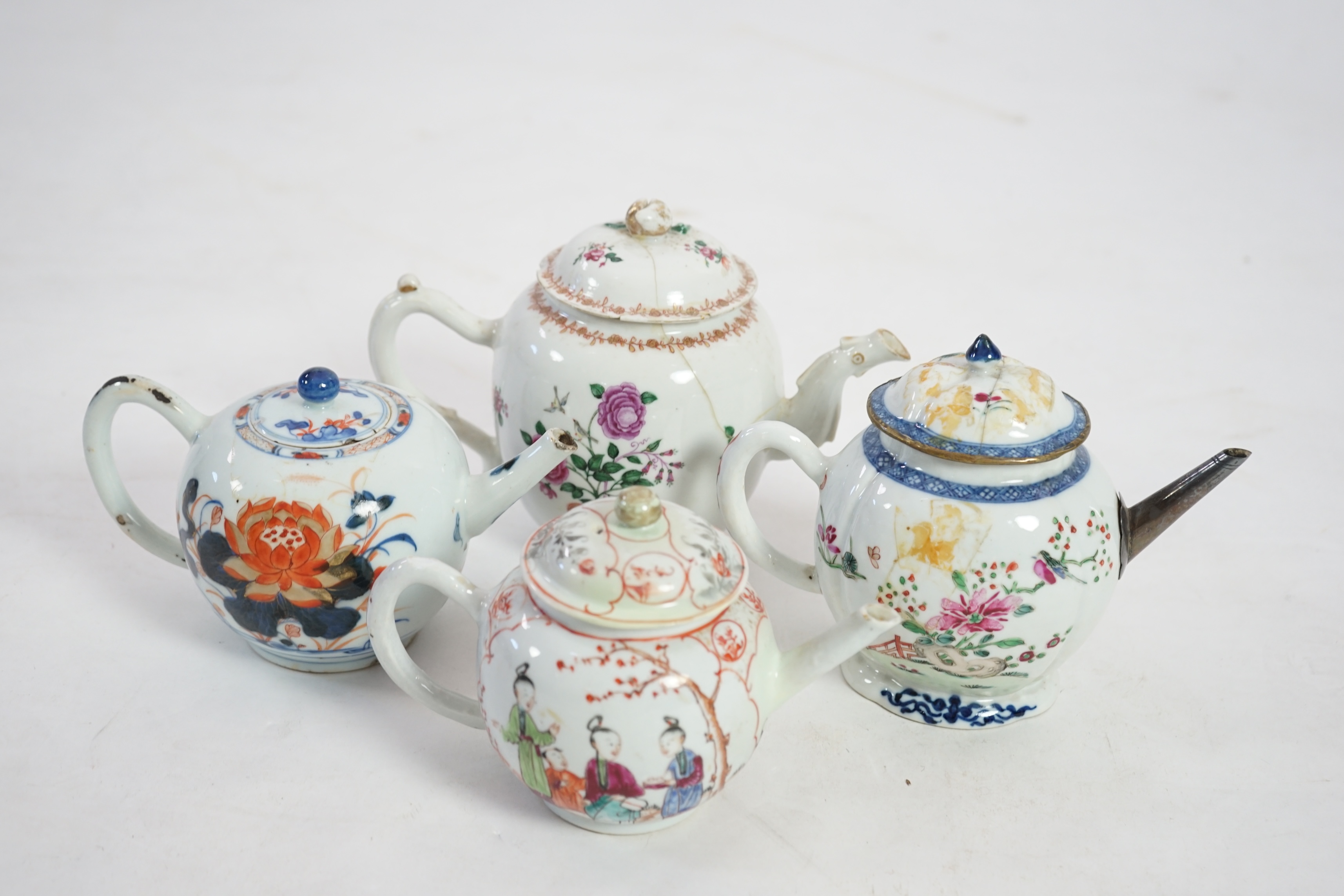 Four 18th century Chinese export polychrome decorated teapots and covers